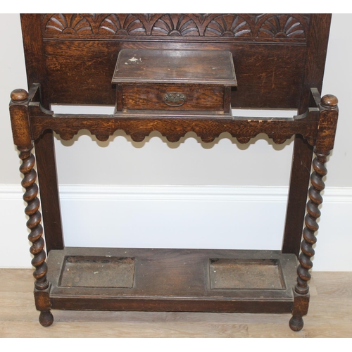 59 - Early 20th century oak hall stand with carved details, barley twist supports and bevelled-edge mirro... 