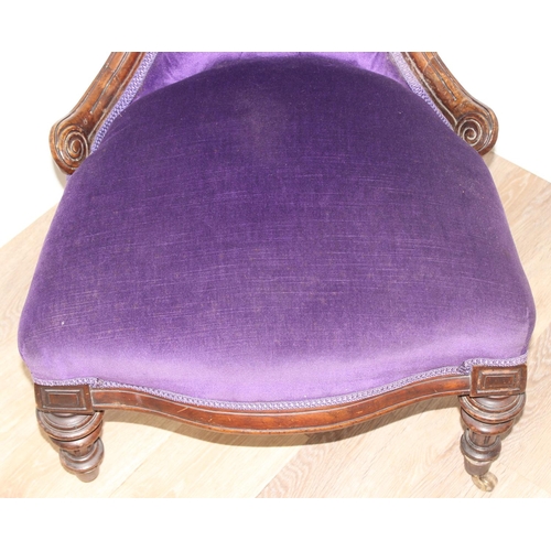 180 - Antique mahogany framed nursing chair with button-backed purple upholstery and carved details, appro... 