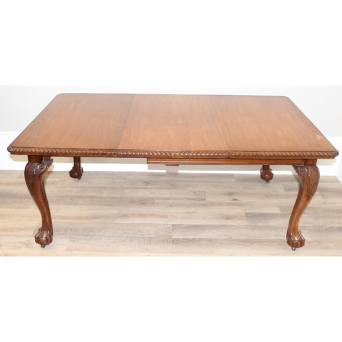 4 - Highly polished mahogany extending dining table with rope edged details and carved legs with ball an... 