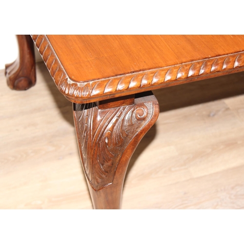 4 - Highly polished mahogany extending dining table with rope edged details and carved legs with ball an... 