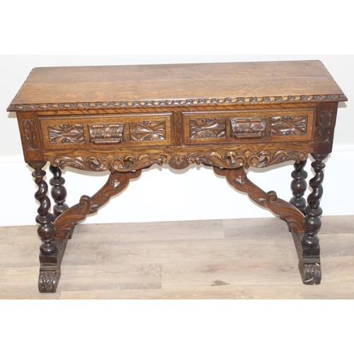 1 - Jacobean style carved oak hall table with barley-twist legs and 2 drawers, approx 110 x 46 x 77cm