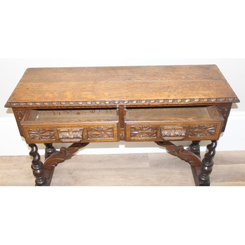 1 - Jacobean style carved oak hall table with barley-twist legs and 2 drawers, approx 110 x 46 x 77cm