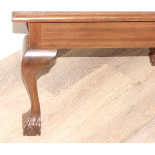 54 - Wooden coffee table with ball & claw feet and glass top, approx 59 x 42 x 47cm