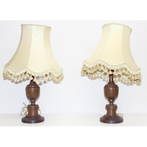 237 - Pair of vintage turned wooden table lamps with shades, approx 58cm and an antique wrought iron stand... 