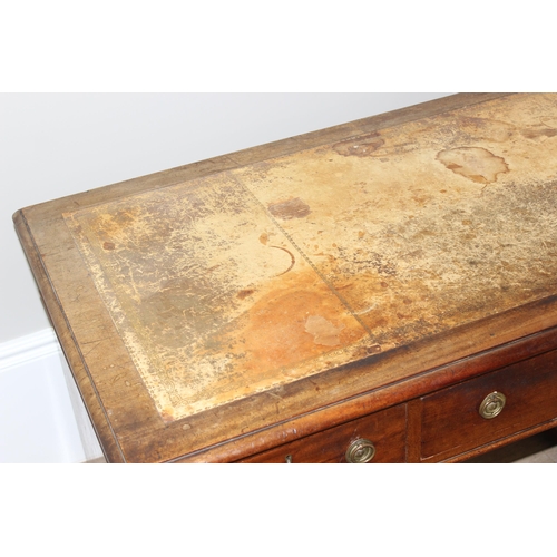 106 - An antique mahogany pedestal desk with 9 drawers and distressed leather top, approx 130cm wide x 69c... 