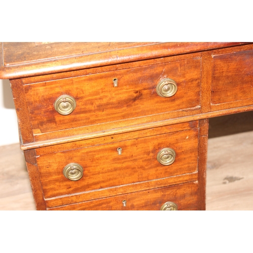 106 - An antique mahogany pedestal desk with 9 drawers and distressed leather top, approx 130cm wide x 69c... 