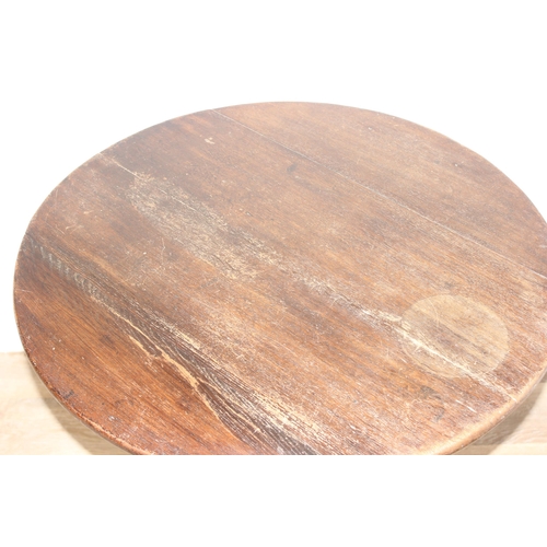 40 - A Georgian oak tilt-top table with tripod base, approx 74cm diameter x 68cm tall