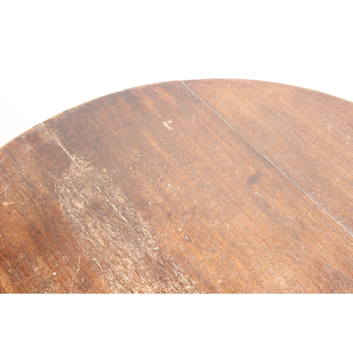 40 - A Georgian oak tilt-top table with tripod base, approx 74cm diameter x 68cm tall