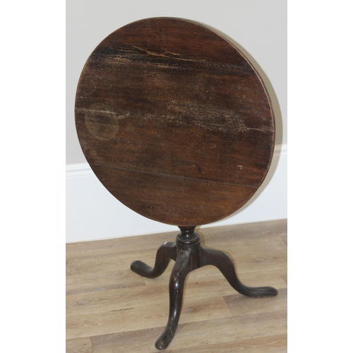 40 - A Georgian oak tilt-top table with tripod base, approx 74cm diameter x 68cm tall