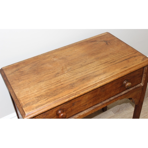 149 - An early 20th century oak console table with single drawer, approx 78cm wide x 42cm deep x 79cm tall