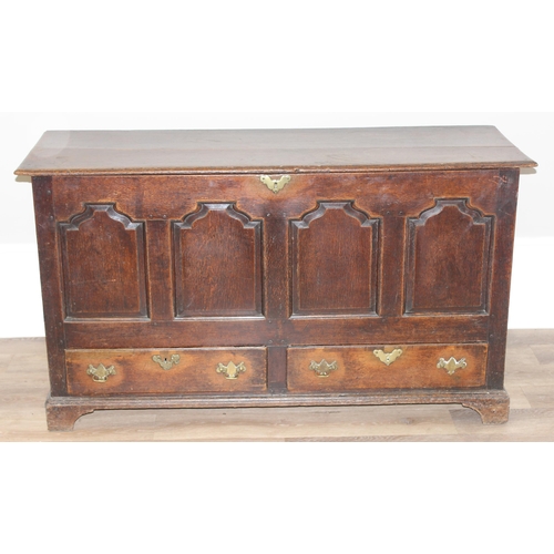 142 - An 18th century oak mule chest with 2 drawers to base, brass fittings, approx 148cm wide x 53cm deep... 