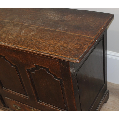 142 - An 18th century oak mule chest with 2 drawers to base, brass fittings, approx 148cm wide x 53cm deep... 