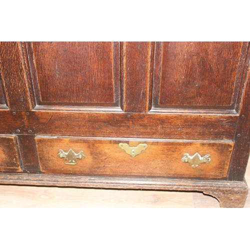 142 - An 18th century oak mule chest with 2 drawers to base, brass fittings, approx 148cm wide x 53cm deep... 