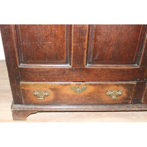 142 - An 18th century oak mule chest with 2 drawers to base, brass fittings, approx 148cm wide x 53cm deep... 