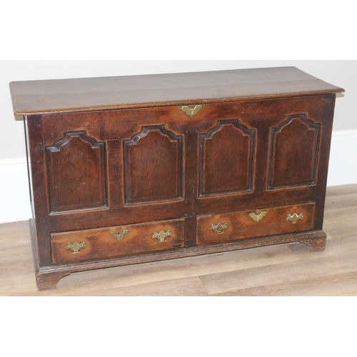 142 - An 18th century oak mule chest with 2 drawers to base, brass fittings, approx 148cm wide x 53cm deep... 