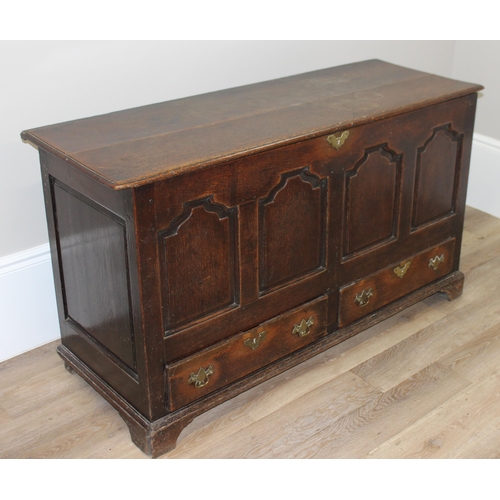 142 - An 18th century oak mule chest with 2 drawers to base, brass fittings, approx 148cm wide x 53cm deep... 