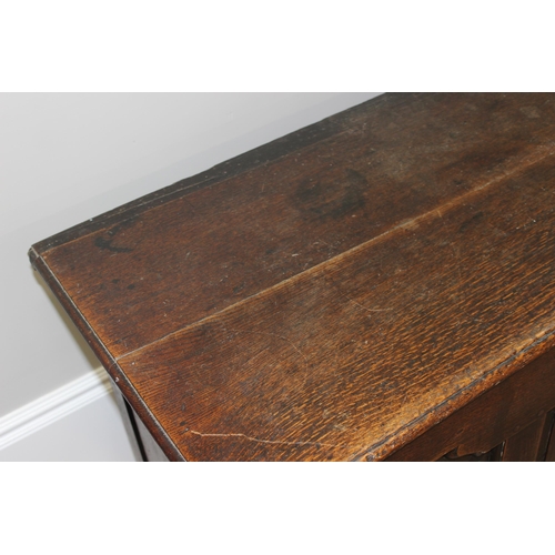 142 - An 18th century oak mule chest with 2 drawers to base, brass fittings, approx 148cm wide x 53cm deep... 