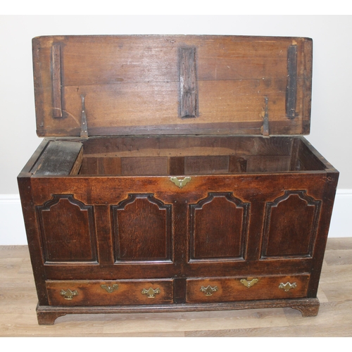 142 - An 18th century oak mule chest with 2 drawers to base, brass fittings, approx 148cm wide x 53cm deep... 