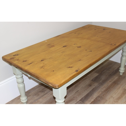 38 - A vintage pine kitchen table with painted base, approx 182cm wide x 91cm deep x 76cm tall