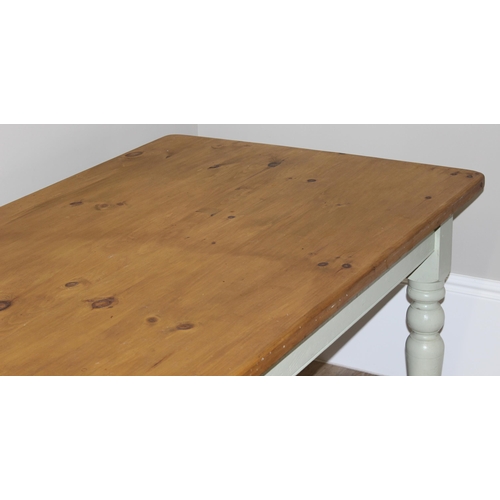 38 - A vintage pine kitchen table with painted base, approx 182cm wide x 91cm deep x 76cm tall