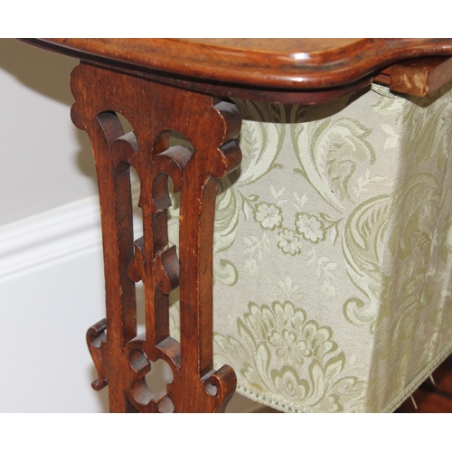 46 - A Victorian walnut sewing table with fabric bag and decorative supports, with contents, approx 59cm ... 