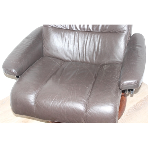 41 - Ekornes leather reclining armchair and matching footstool in chocolate colour, armchair approx 96cm ... 