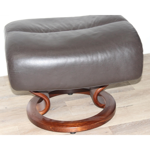 41 - Ekornes leather reclining armchair and matching footstool in chocolate colour, armchair approx 96cm ... 