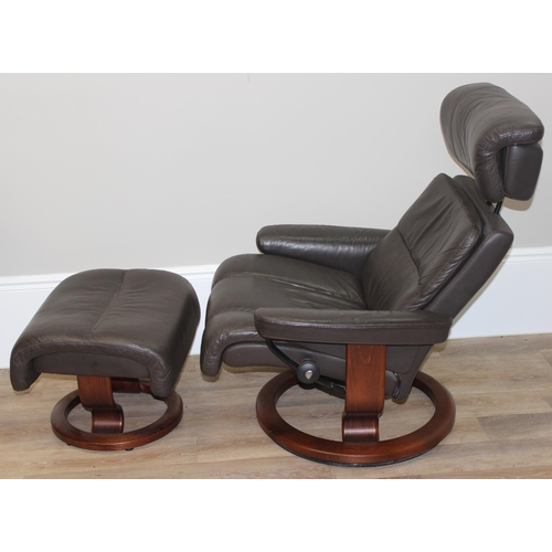 41 - Ekornes leather reclining armchair and matching footstool in chocolate colour, armchair approx 96cm ... 