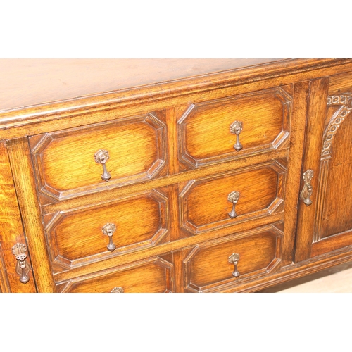 151 - A 17th century style carved oak sideboard with barleytwist supports, approx 152cm wide x 51cm deep x... 