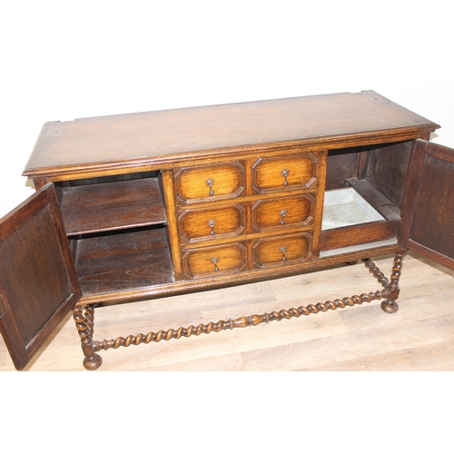 151 - A 17th century style carved oak sideboard with barleytwist supports, approx 152cm wide x 51cm deep x... 