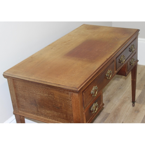 140 - A vintage mahogany desk with 4 drawers, approx 115cm wide x 55cm deep x 78cm tall