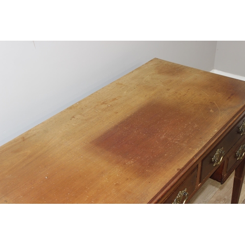 140 - A vintage mahogany desk with 4 drawers, approx 115cm wide x 55cm deep x 78cm tall