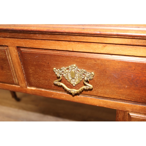 140 - A vintage mahogany desk with 4 drawers, approx 115cm wide x 55cm deep x 78cm tall