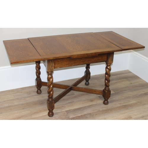 43 - An early 20th century oak extending dining table with barley-twist supports, approx 91cm wide (151cm... 