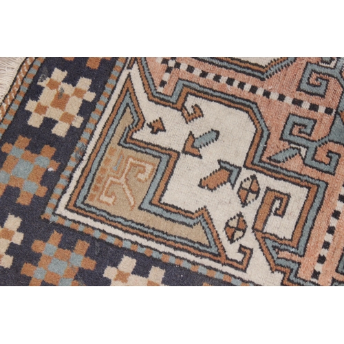 201 - A vintage Oushak style rug with geometric patterns, possibly Turkish in origin, approx 105cm x 95cm