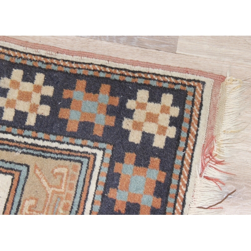 201 - A vintage Oushak style rug with geometric patterns, possibly Turkish in origin, approx 105cm x 95cm