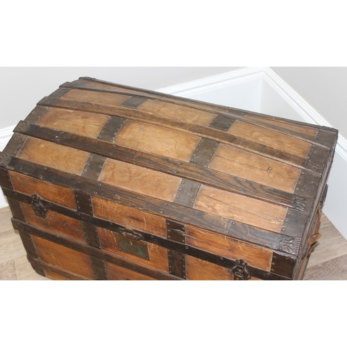 127 - An antique pine and iron-bound dome-top trunk or chest, approx 87cm wide x 51cm deep x 62cm tall