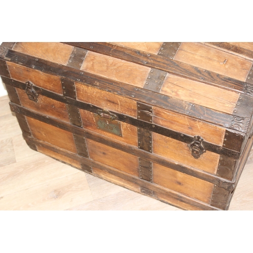 127 - An antique pine and iron-bound dome-top trunk or chest, approx 87cm wide x 51cm deep x 62cm tall