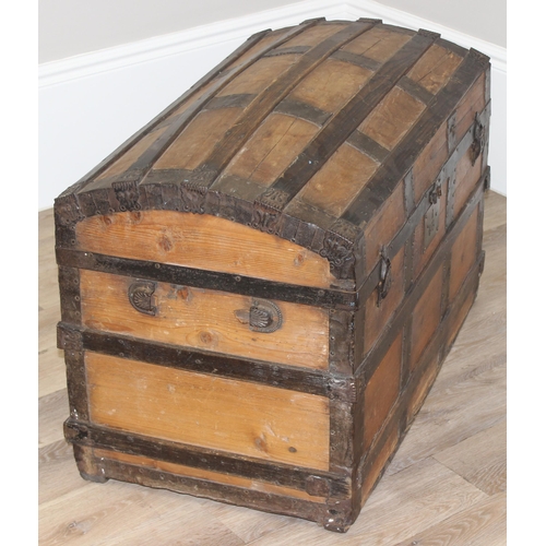 127 - An antique pine and iron-bound dome-top trunk or chest, approx 87cm wide x 51cm deep x 62cm tall