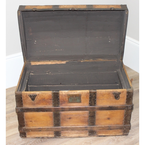 127 - An antique pine and iron-bound dome-top trunk or chest, approx 87cm wide x 51cm deep x 62cm tall