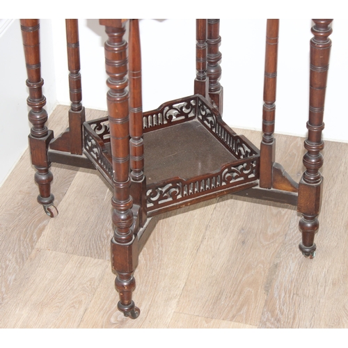 42 - An Edwardian octagonal topped mahogany side table with decorative fretwork base, approx 61cm wide x ... 