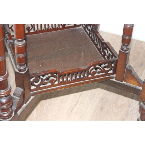 42 - An Edwardian octagonal topped mahogany side table with decorative fretwork base, approx 61cm wide x ... 