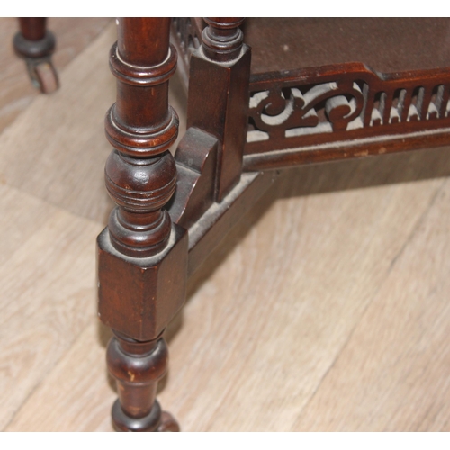 42 - An Edwardian octagonal topped mahogany side table with decorative fretwork base, approx 61cm wide x ... 