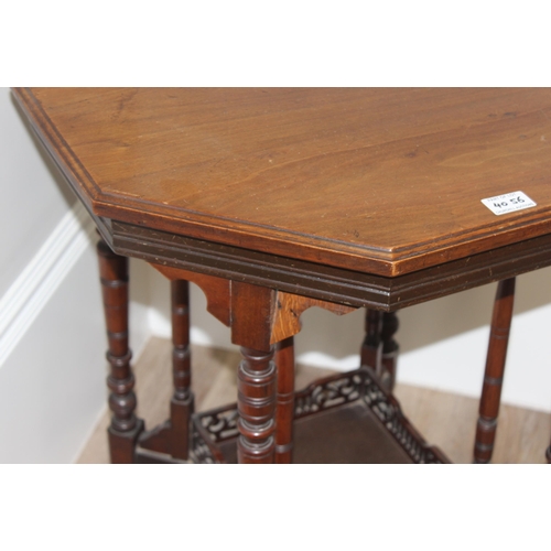 42 - An Edwardian octagonal topped mahogany side table with decorative fretwork base, approx 61cm wide x ... 