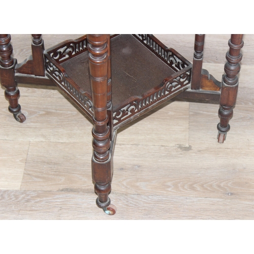 42 - An Edwardian octagonal topped mahogany side table with decorative fretwork base, approx 61cm wide x ... 