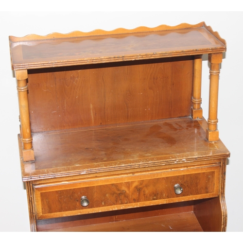 139 - An antique style yew finished waterfall bookcase with pie crust edged top, approx 46cm wide x 28cm d... 