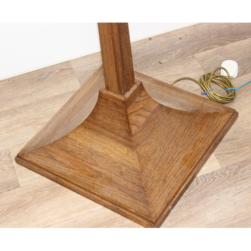 243 - An impressive oak standard lamp with unusual shaped base, approx 160cm tall