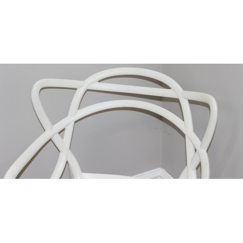 66 - Masters by Kartell of Italy, a retro style white plastic chair with shaped back, approx 83cm tall