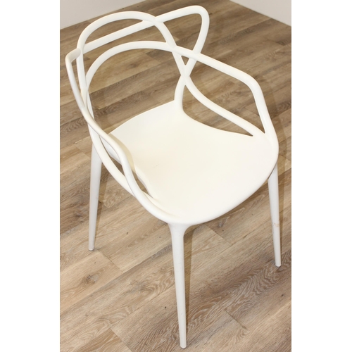 66 - Masters by Kartell of Italy, a retro style white plastic chair with shaped back, approx 83cm tall