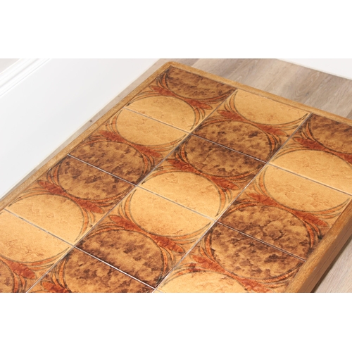 58 - A retro Danish tile-top coffee table by Trioh, approx 126cm wide x 65cm deep x 43cm tall